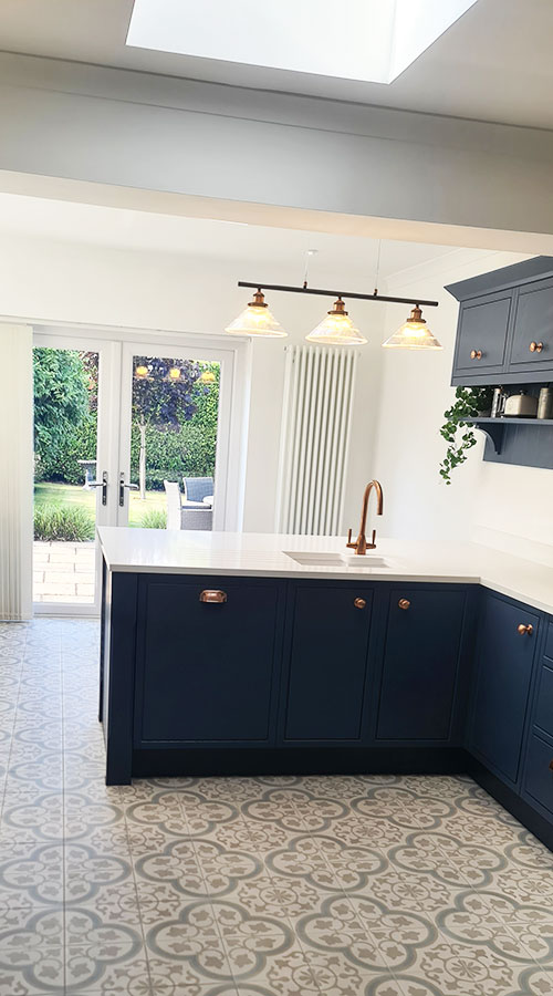 Fitting of dark bue modern kitchen in Congleton home.